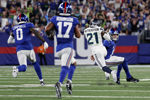 Rookie Devon Witherspoon scores on 97-yard pick-6 as Seahawks' defense  leads Seattle over Giants - The Republic News